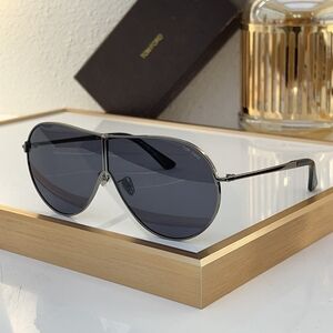 TOM has a pair of sunglasses